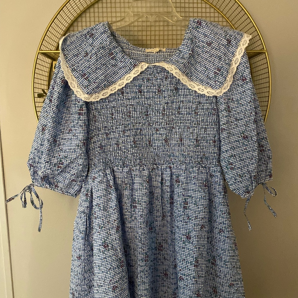 Our Julianna Mini Dress is a blue and white printed babydoll dress